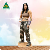 Woman wearing camouflage pants and a brown top on a colorful background with 'Australian Made' logo.
